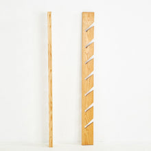 Load image into Gallery viewer, Side profile of Swedish ash magazine rack by Källemo, designed by Jonas Bohlin in 1988 with sculptural vertical lines.